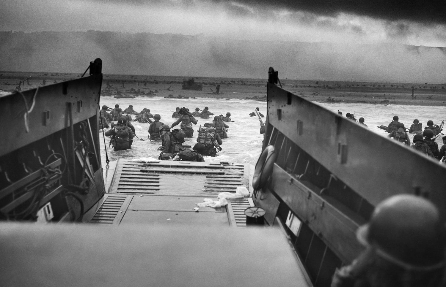 Into the Jaws of Death: A Coast Guard-staffed LCVP from the USS Samuel Chase disembarks Company A, 1st Battalion, 16th Infantry Regiment assaulting Omaha Beach on the morning of 6 June 1944.