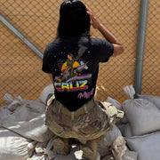 B-2 Spirit Cruz Missile Retrowave Air Force Pin-Up Girl Judy Operation Epic Fury graphic t-shirt with stealth bomber and retro neon background lifestyle shot v4