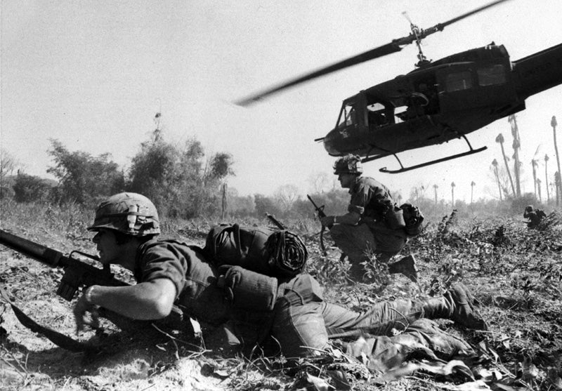 Major Bruce P. Crandall's UH-1D helicopter climbs after discharging infantrymen on a search and destroy mission in Ia Drang Valley in November 1965.