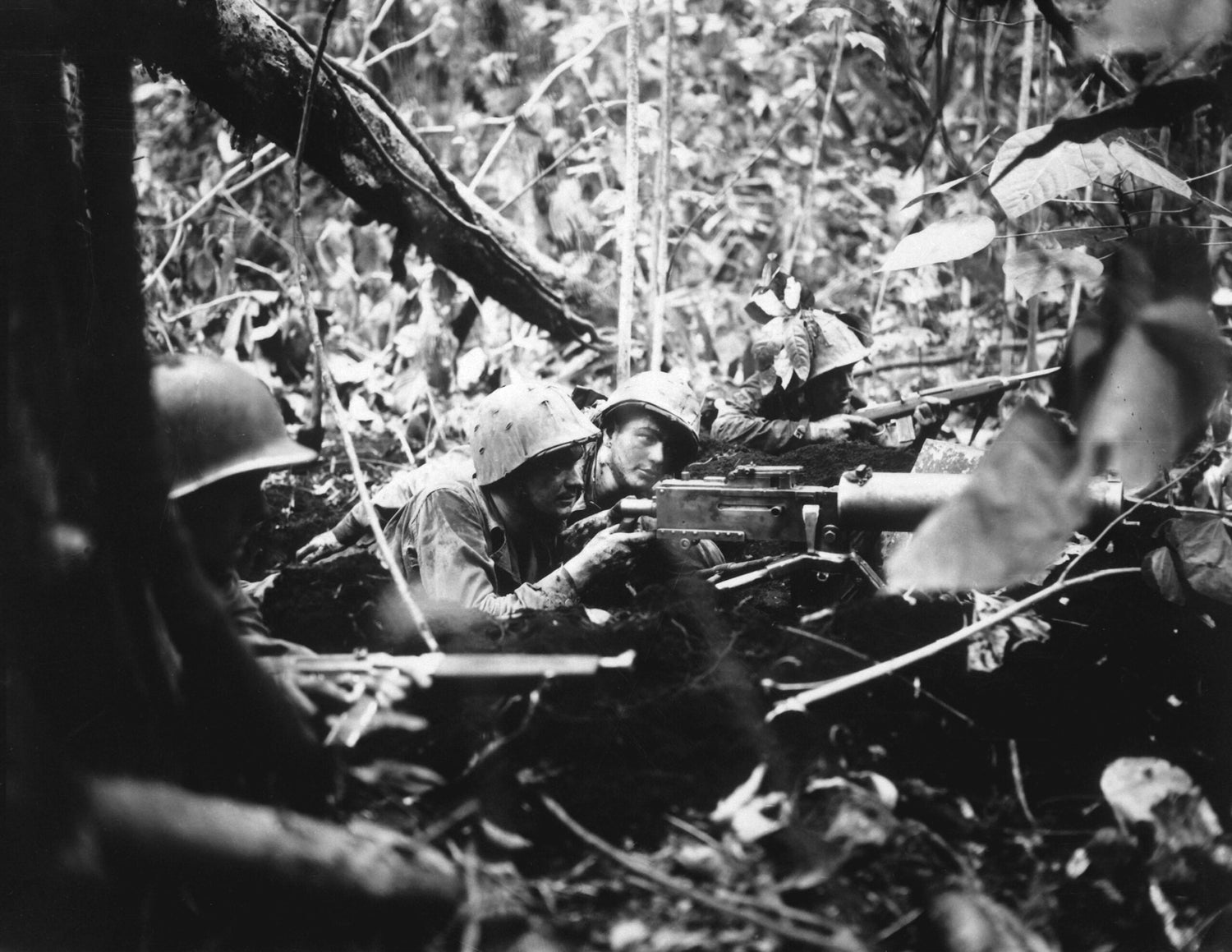 Retreating at first into the jungle of Cape Gloucester, Japanese soldiers finally gathered strength and counterattacked their Marine pursuers. These machine gunners pushed them back.